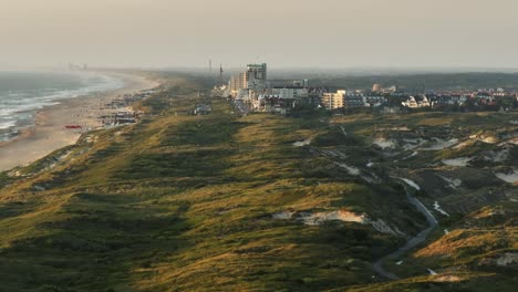 Aerial-view-over-coastal-dunes-and-beach-of-Noordwijk-town,-Netherlands