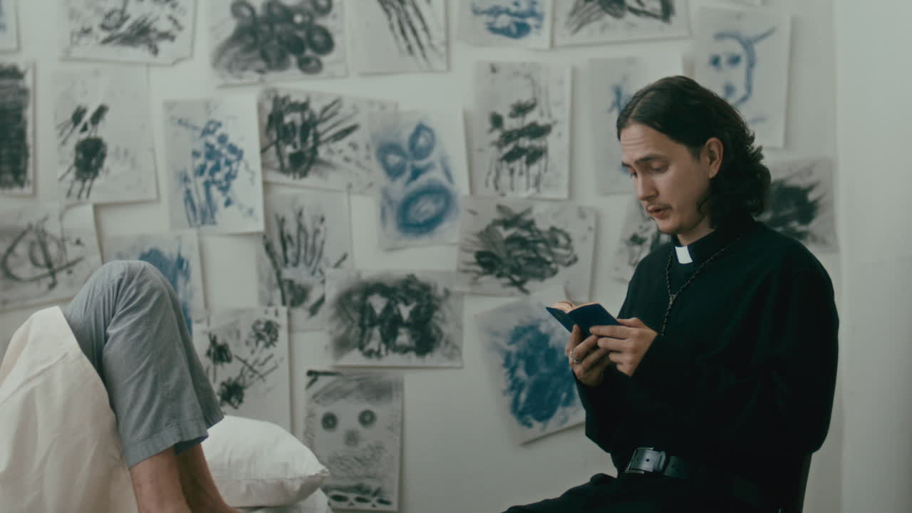 Psychiatric Patient Listening to Priest Reading Bible Aloud in Hospital Ward