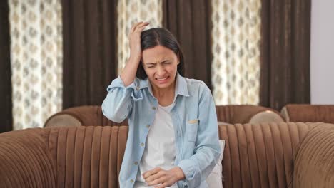 indian woman suffering from headache