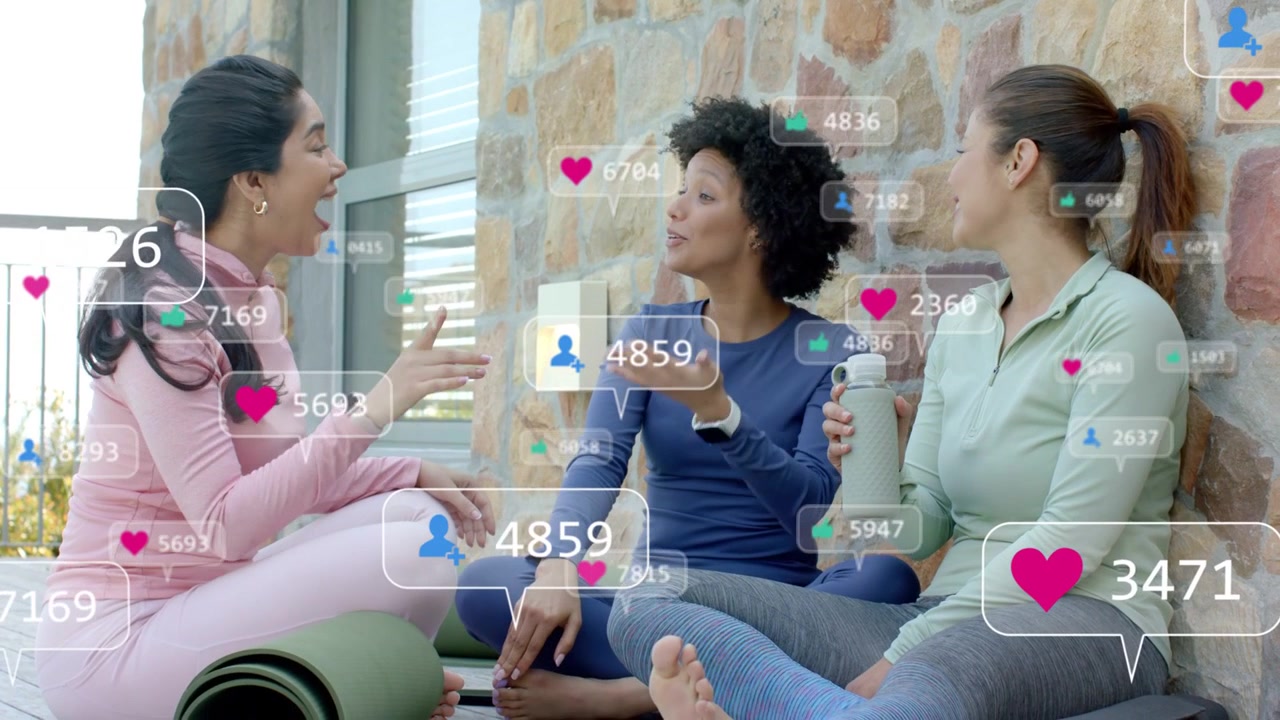 Three women chatting on mats, sparking hearts and counts appearing, rising, fading for wellness