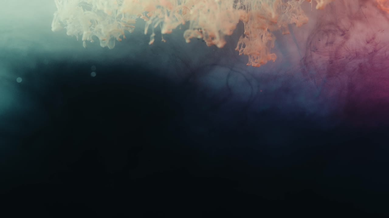 Slow Motion Of Liquid Smoke Dropping In Colorful Surface