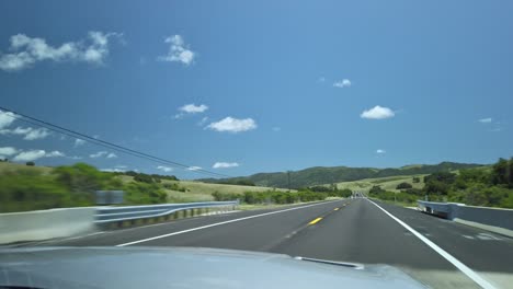 Driving-through-beautiful-scenery-on-a-sunny-day-in-California,-USA