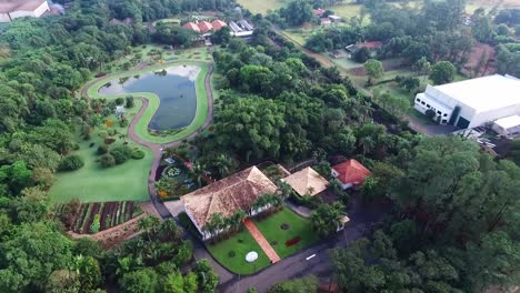 old farmhouse near lake in interior of brazil. aerial high angle rising