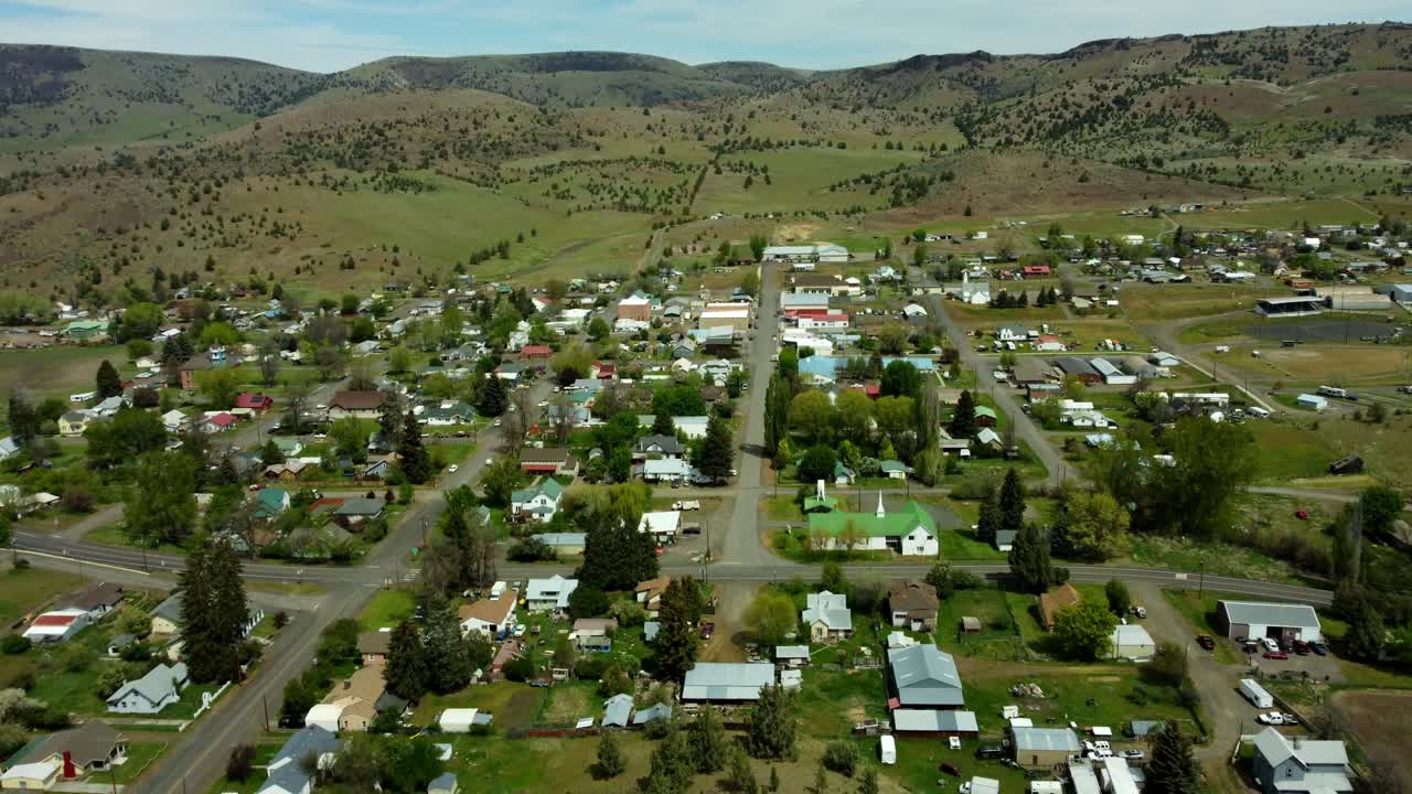 US, Oregon, Fossil, , 2025-05-07 - Drone view of the city of Fossil in north central Oregon, with the Wheeler High School at the end