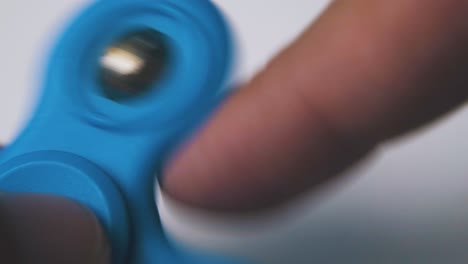 person turns bright spinner with ball on light background