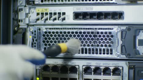 cleaning data center equipment: routine maintenance on server hardware to ensure optimal performance and longevity of critical network infrastructure components