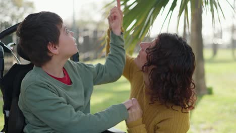 mother and child with disability in park