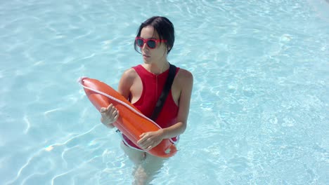 lifeguard walking through shallow water