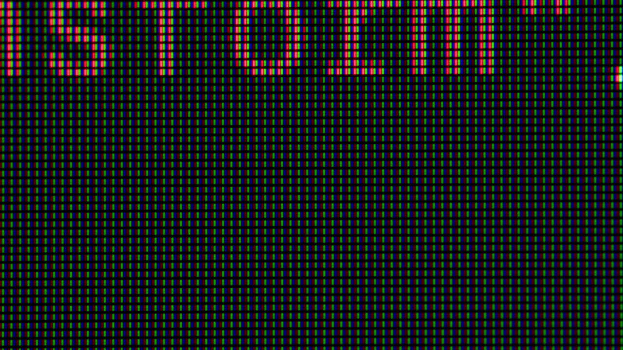 Close-up of a Pixelated Computer Screen Displaying Numbers