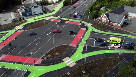 aerial view vehicles travelling st helens cyclops traffic optimisation junction crossroad intersection, panning left