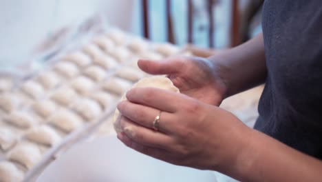 Woman-making-dumplings-at-home