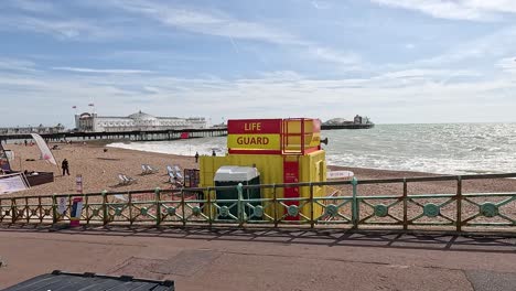 beachgoers near lifeguard tower on sunny day