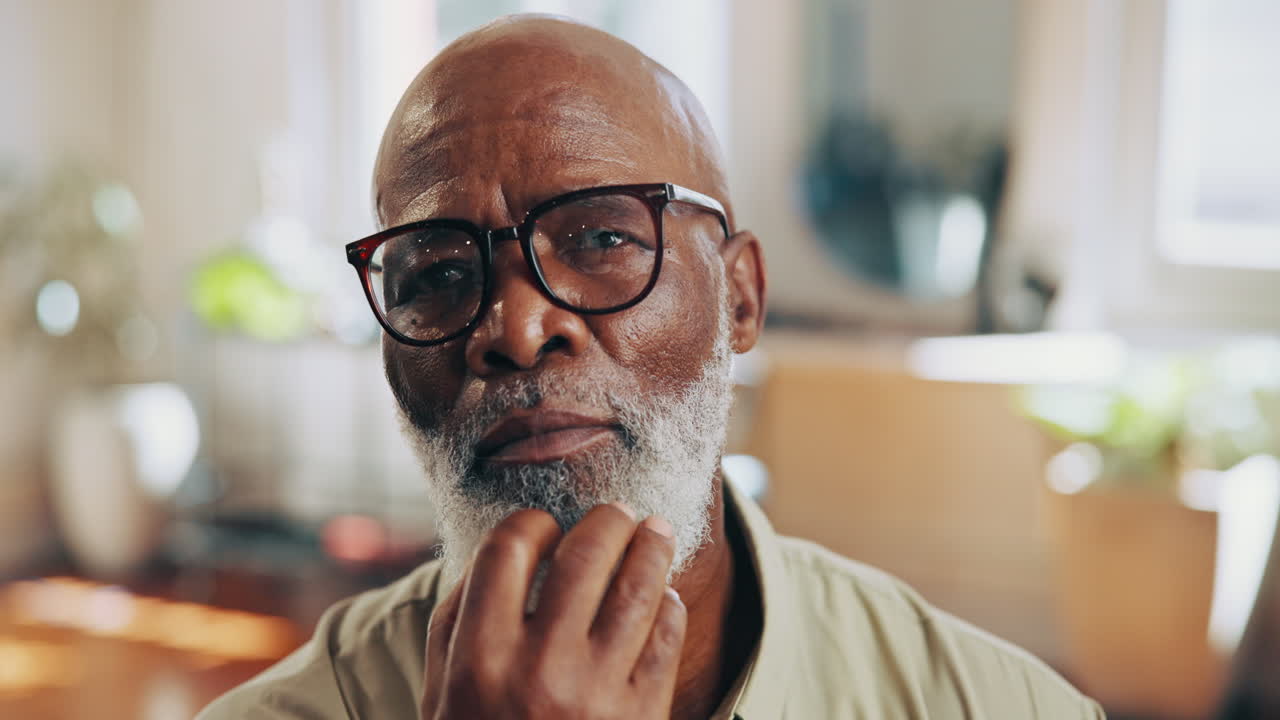 Thoughtful Senior African American Man Looking at Camera