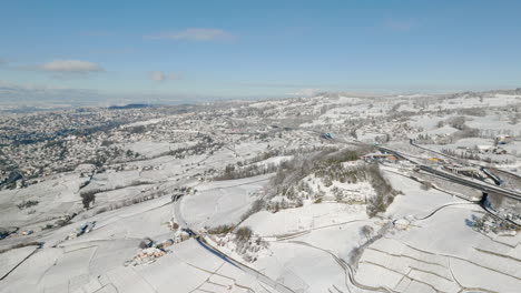 Aerial-View-Of-Lavaux-Vineyard-With-Lutry-And-Lausanne-In-The-Background-During-Winter-In-Switzerland