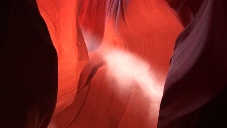 mediumshot of a light beam shooting through antelope canyon in arizona