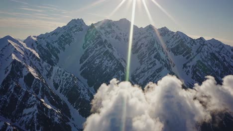 majestic mountain peaks pierced by sunlight