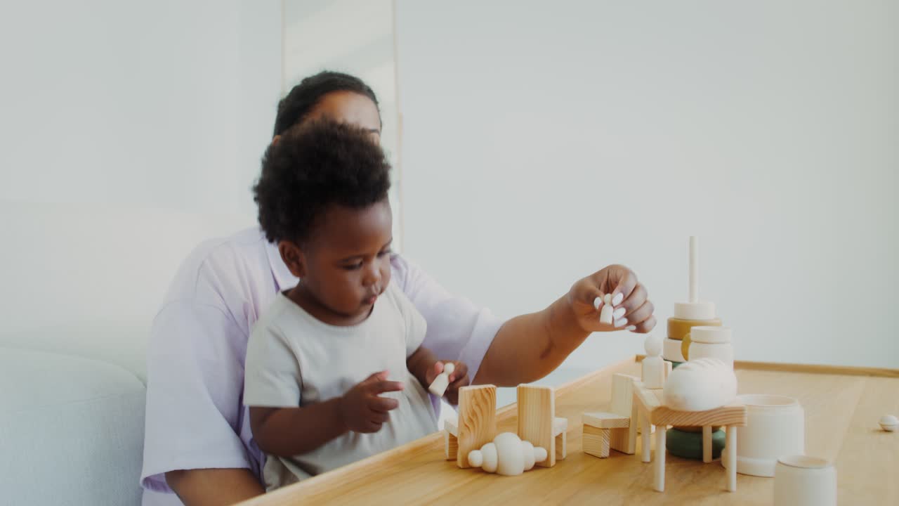 Mother and Child Playing with Wooden Blocks
