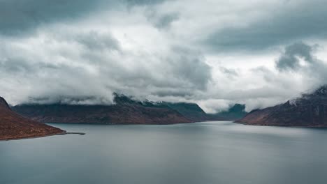 Dramatic-cloudscape-over-the-dark-blue-sea,-Thick-white-clouds-forming,-moving-and-disappearing