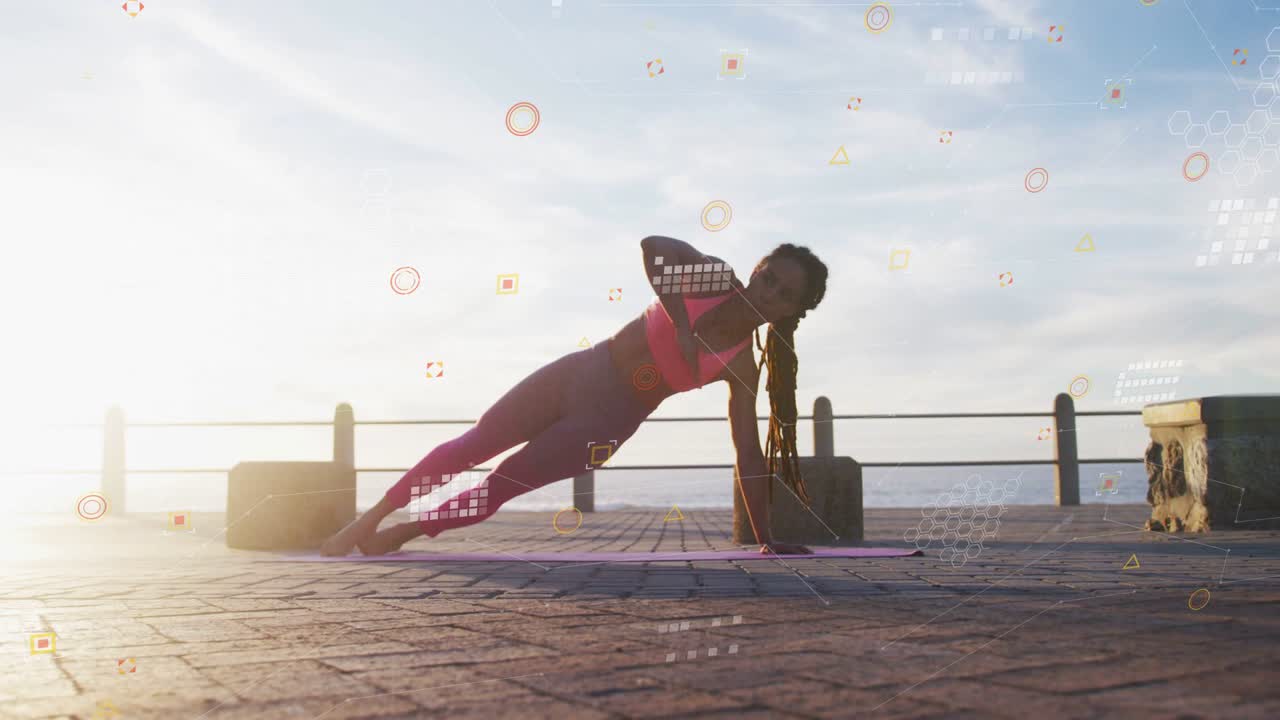 Woman doing fitness routine by ocean, shifting onto right hand, HUD highlighting form for balance