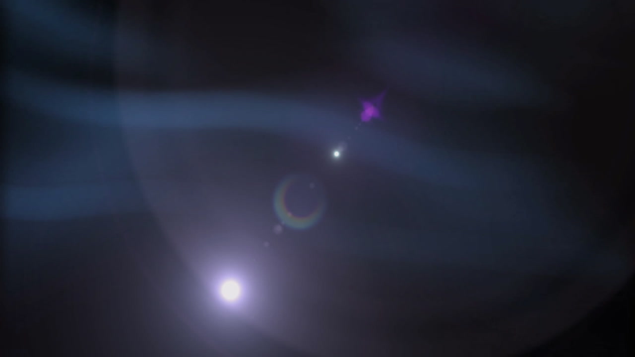 Glowing lights creating cosmic atmosphere with lens flares in animation design