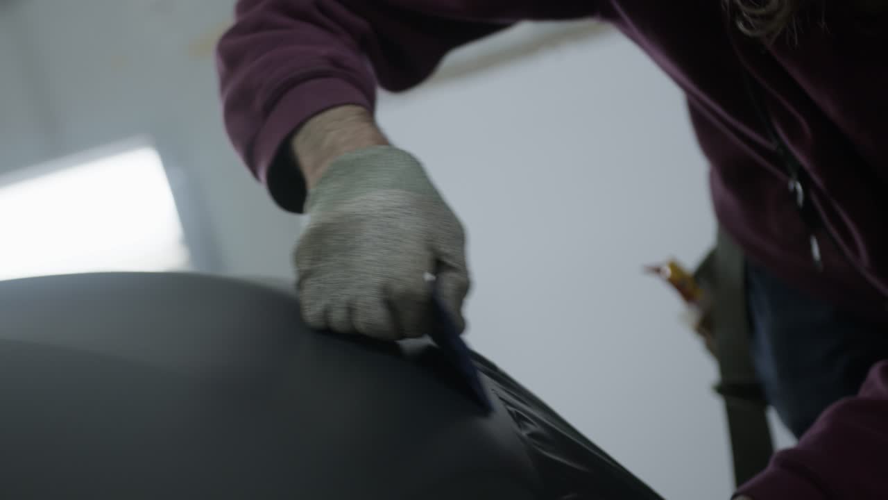 Vehicle wrap installation with squeegee