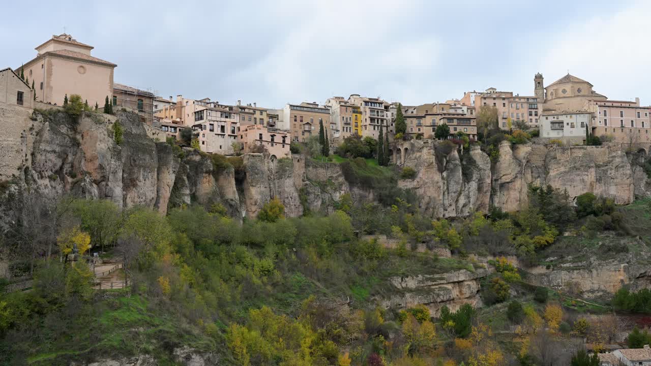 CUENCA, SPAIN - The famous Hanging Houses (Casas Colgadas) built on the edge of a cliff. A unique view of the historic UNESCO World Heritage city on an overcast winter day.