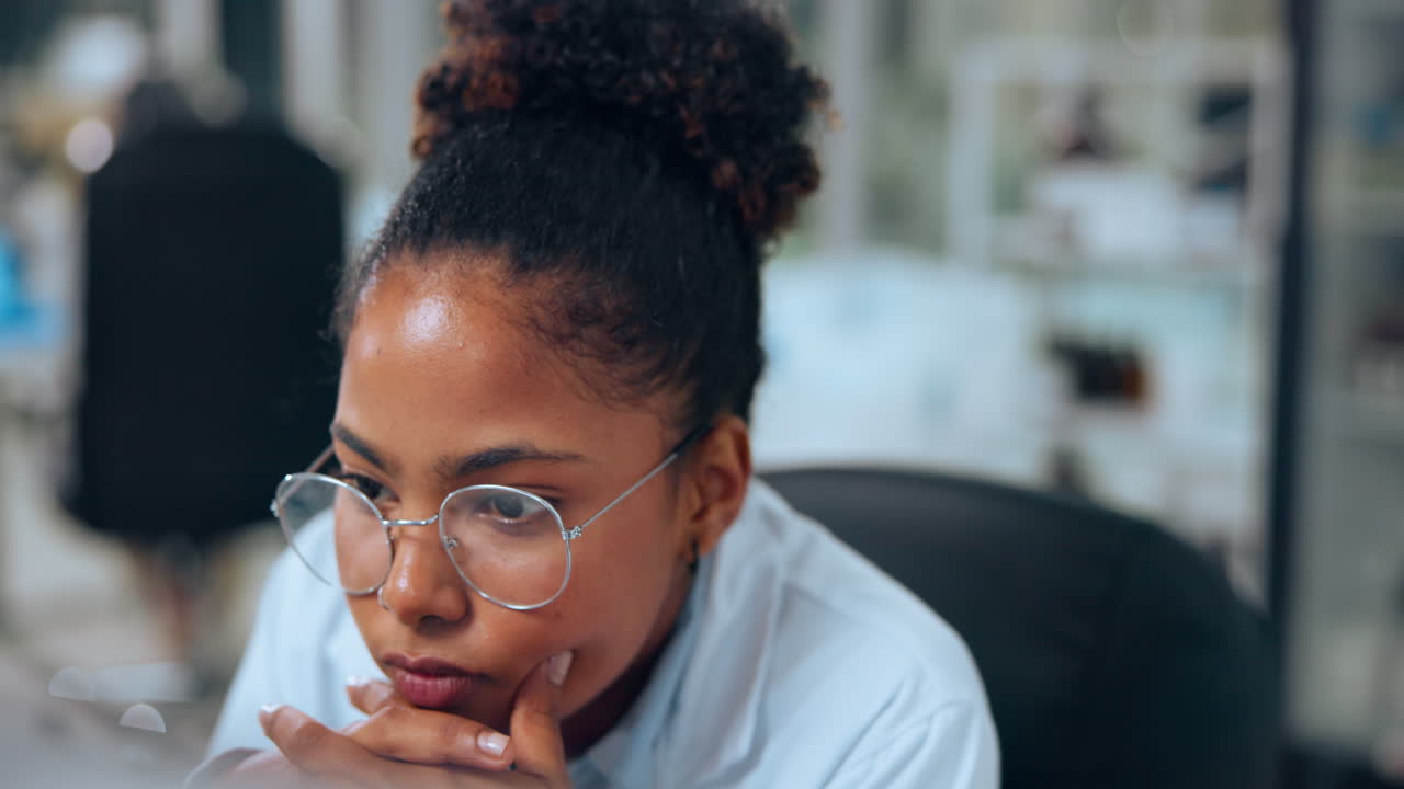 Focused Female Scientist Working on Computer in a Modern Laboratory