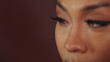 close-up of a woman with eyeliner and false eyelashes