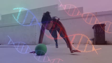 Animación-De-Hebras-De-Adn-Girando-Sobre-Una-Mujer-Haciendo-Flexiones,-Haciendo-Ejercicio-Con-Pelota-En-El-Gimnasio