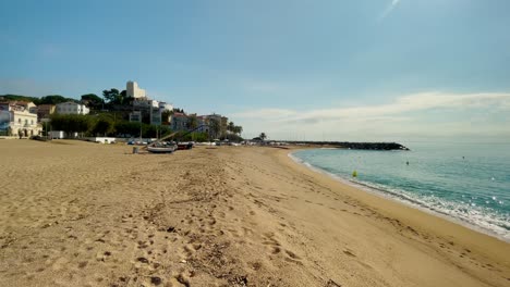 Platja-de-les-Barques-sea-field-Maresme-Barcelona-Mediterranean-coast-plane-close-to-turquoise-blue-transparent-water-beach-without-people