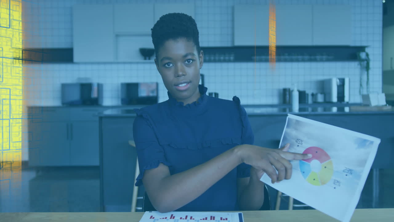 Woman presenting business data in office break room, with animated pie chart and rising bar graph