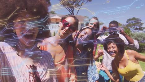 creative team sharing sunglasses outdoors under umbrella, showing floating tech circuit graphics
