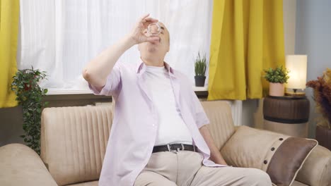 old man drinking water for healthy life.