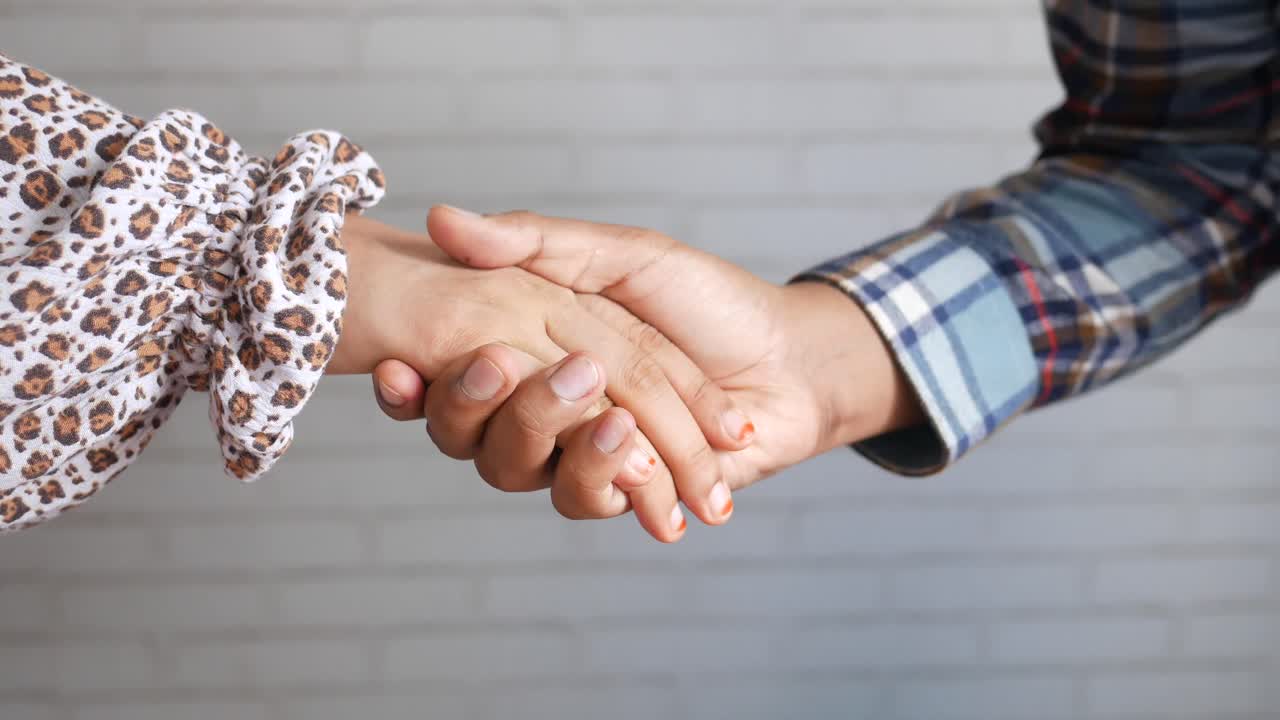 el apretón de manos