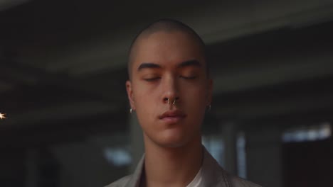 fashionable young man in an abandoned warehouse