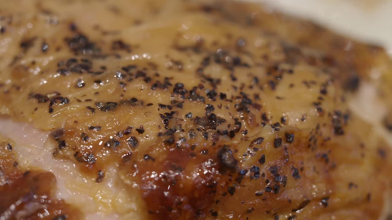Close-up of Crispy, Seasoned Roasted Meat