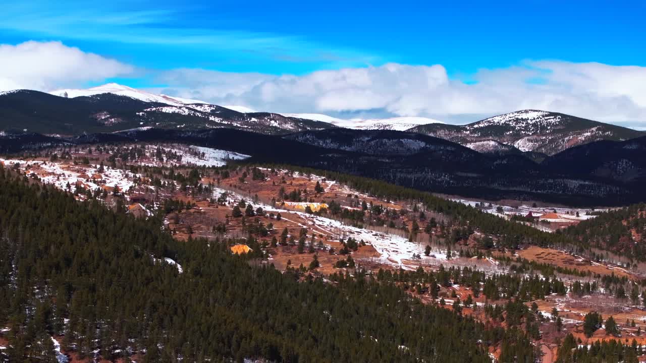 Gold mining Indian Peaks Nederland Eldora Historic Central City Parkway Black Hawk Casinos Idaho Springs aerial drone Colorado Gilpin County winter bluesky sunny clouds Rocky Mountains forward pan up