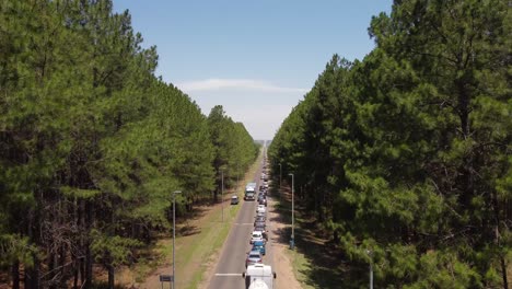 traffic jam with long queue of trucks and cars on rural gualeguaychu-fray bentos road at border between argentina and uruguay