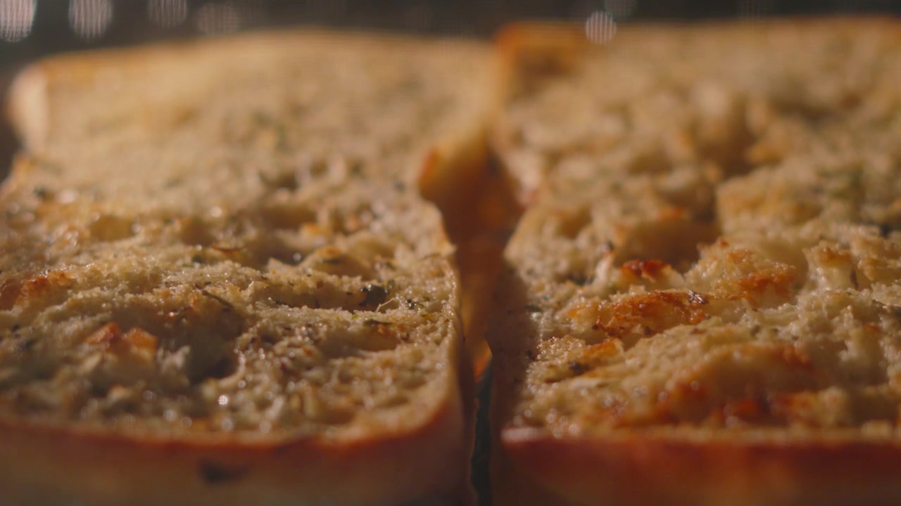 Artisanal Garlic Herby Ciabatta Bread Cooking in Hot Oven. Perfect for cooking shows, recipe videos, and casual dining advertisements. 4K.