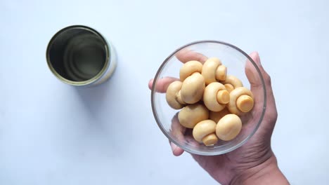 canned mushrooms in a glass bowl