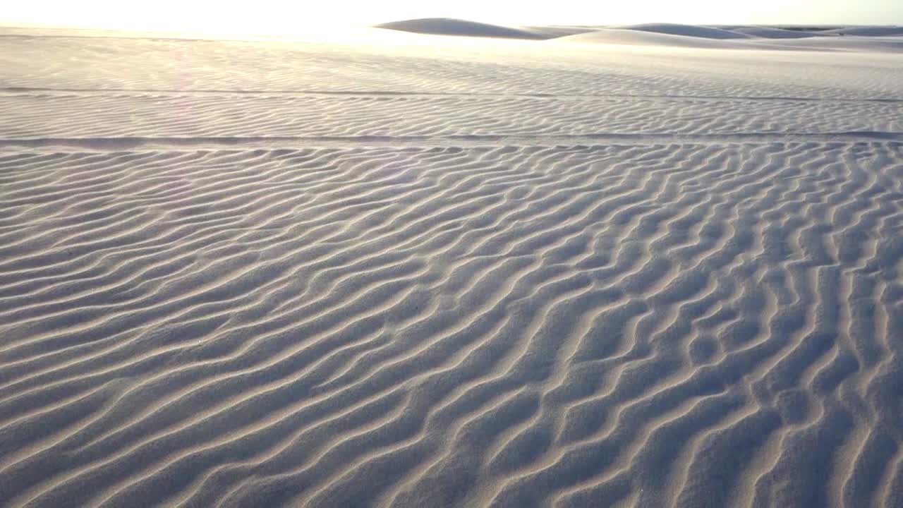 textured sand dunes, wind blowing, sunset. Great Sand Dunes of Brazil. Summer travel destination. Beauty in nature landscape. Desert dunes tropical climate