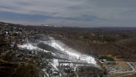 aerial push in to appalachian ski mountain in 4k