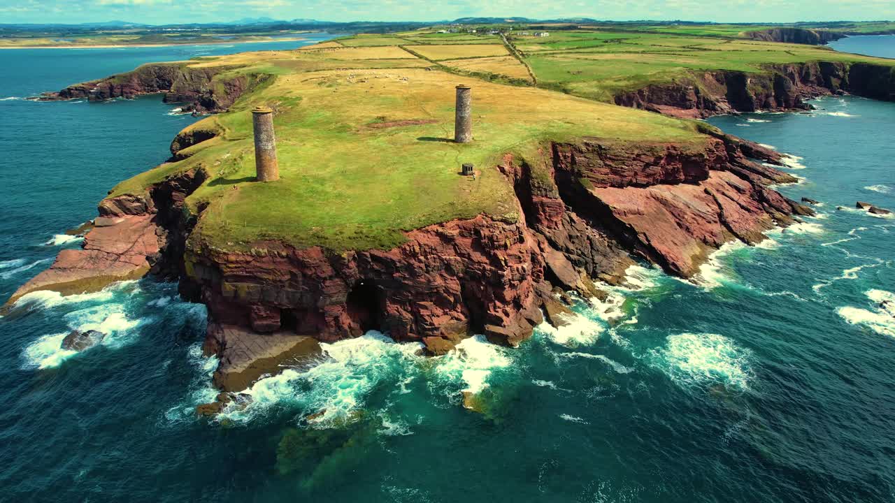 A slight drone sliding shot of Brownstown Head cliffs towards Wexford