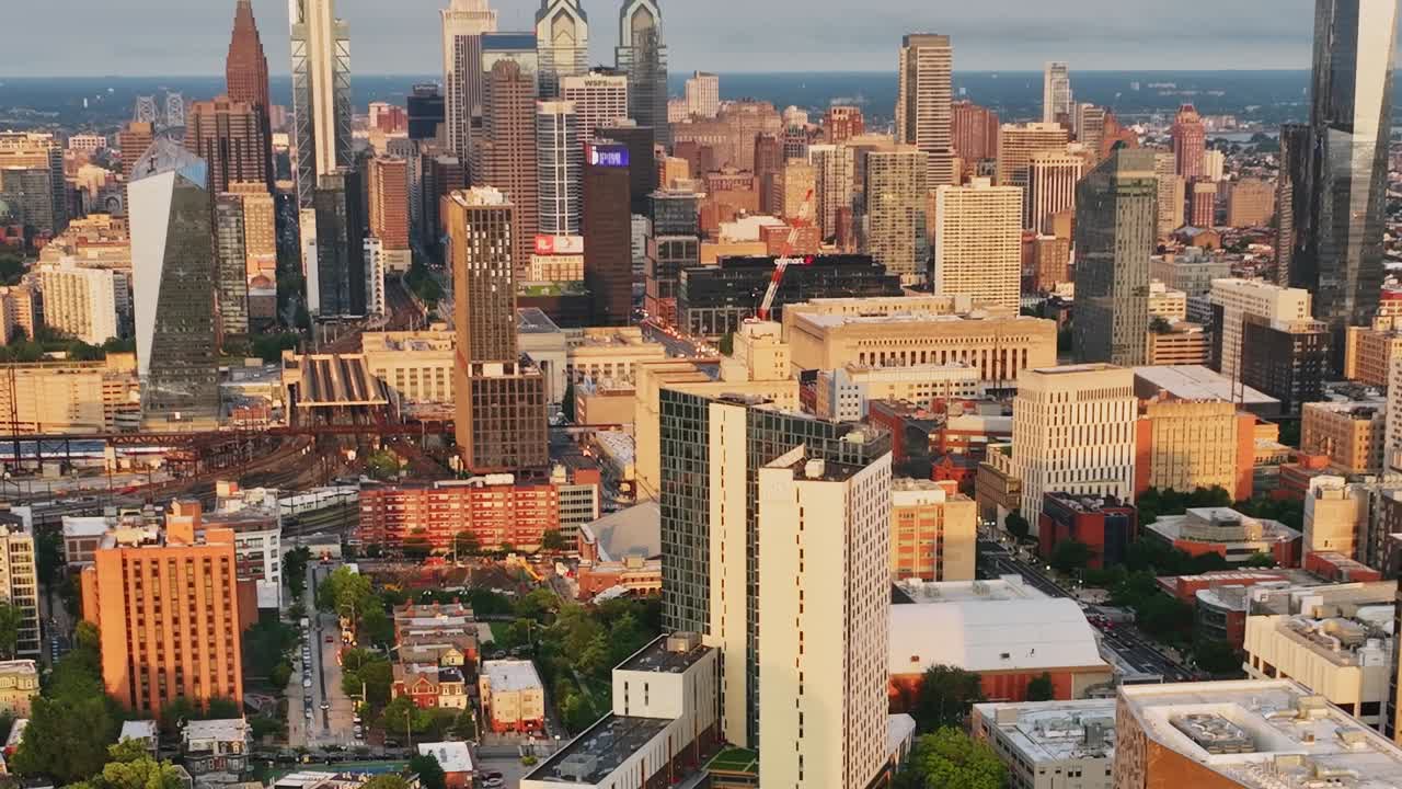 View of Philadelphia skyline with buildings and clouds at sunset