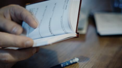 close-up of hand writing in a notebook, white pages, symbolizing creativity and personal reflection, capturing the essence of thought and expression.