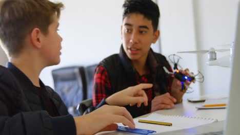 Kids-discussing-over-drone-model-4k