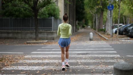 woman running on a city street