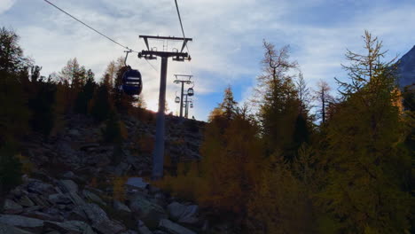 Morning-sunlight-fall-autumn-Larks-forest-Saastal-Saas-Fee-Switzerland-gondola-ride-top-of-Swiss-Alps-glacier-mountain-peak-summer-morning-stunning-clear-blue-sky-alpine-valley-Zermatt-Alphabel-static