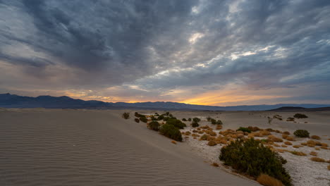 dramatic sunset over desert dunes