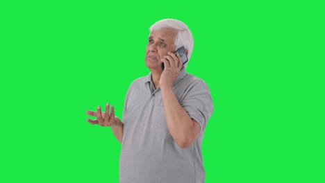 Indian-old-man-talking-on-call-Green-screen